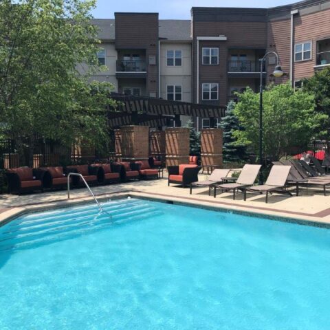 Photo Of Patio Chairs On A Cement Patio With A Pool