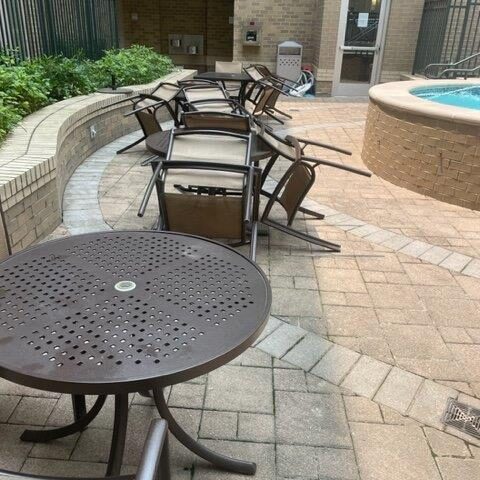 Photo Of Patio Chairs On A Cement Patio With A Pool