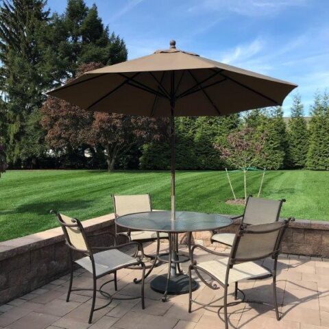 Photo Of A Restored Patio Set With Four Chairs And Table With Umbrella